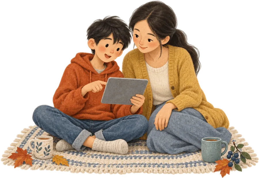 A boy and a grown-up sitting together on a rug, looking at a tablet he is holding, with two mugs beside them